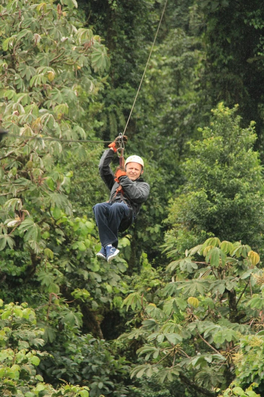 a person riding an aerial device high in the air