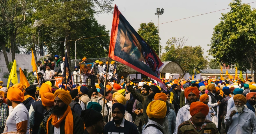 a crowd of people that are standing in the street