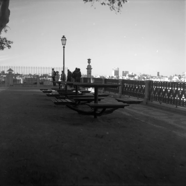 a person sitting on top of a wooden bench