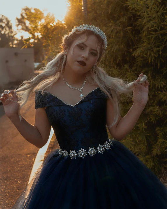 a woman wearing an elaborate dress poses for a po