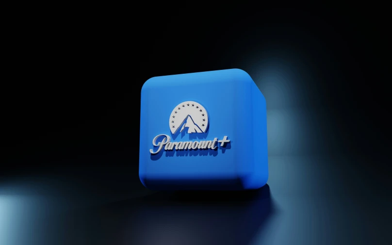 a bright blue object in the dark with a logo on it