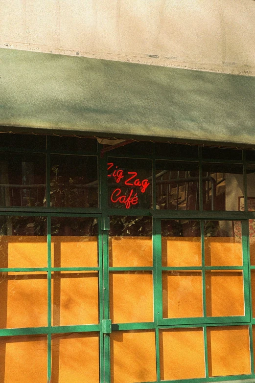 an open window with graffiti writing on it