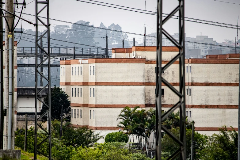 a large building that has some poles by it