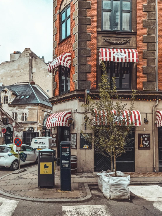 a street view of a building with awnings