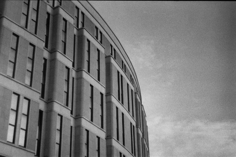 a black and white po of a building with three windows