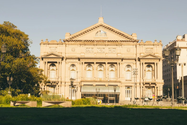 an ornate building stands alone in the park