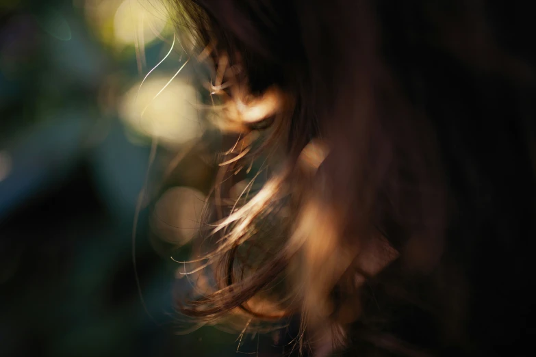 a blurry pograph of the side of a woman's head