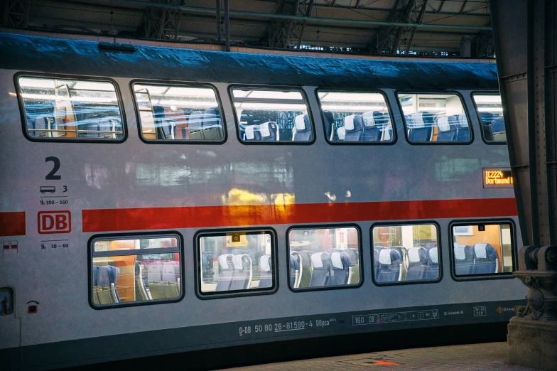 an amtrak car with its reflection in the windows