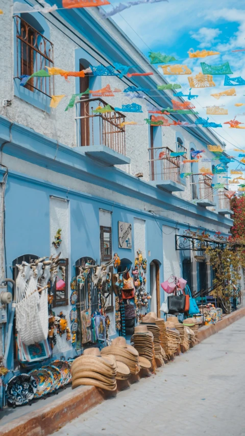 a blue building with a store selling art