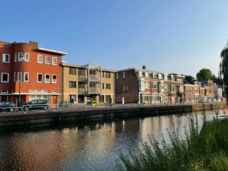 the view of a waterway and a row of building on the other side