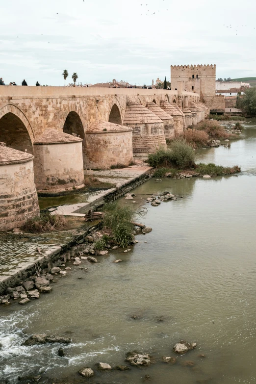 an old, run down bridge spanning the water