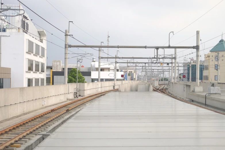 a train tracks that goes under a station