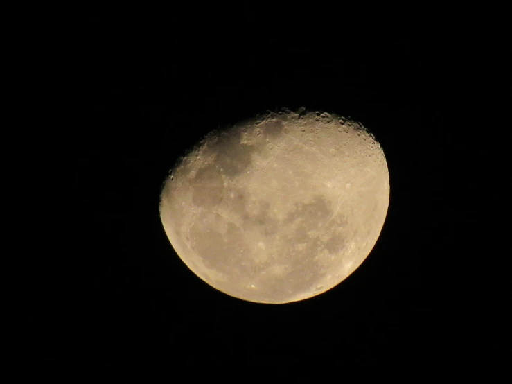 a close up of the moon on a dark sky