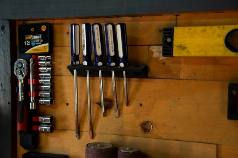 tools on a piece of wood are shown in this image