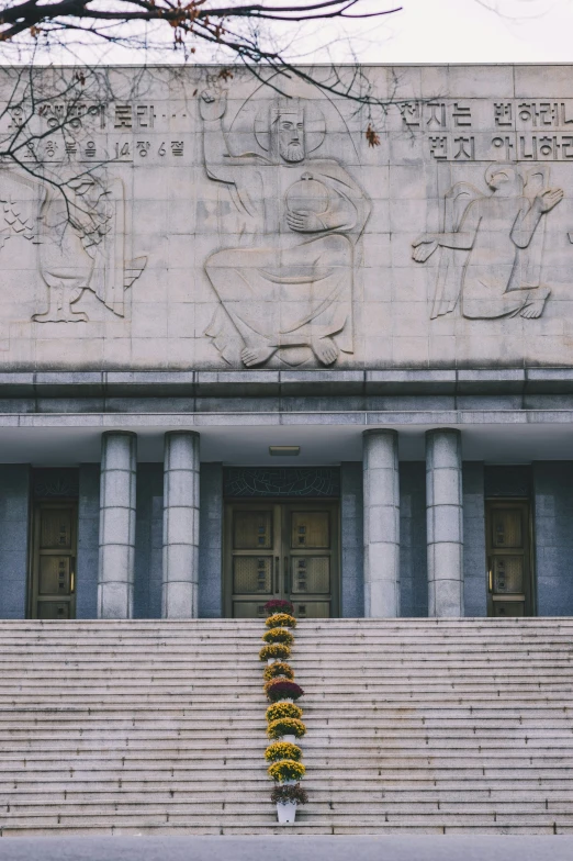 a building with a long row of steps and planters