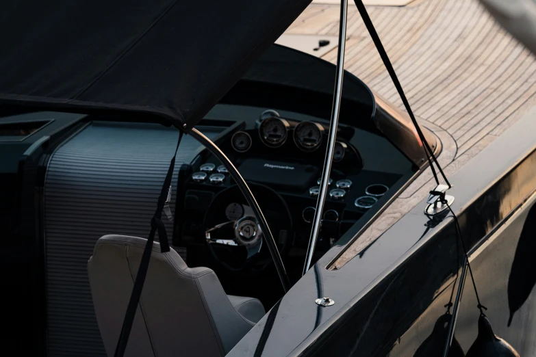 the cockpit of a small boat at dock