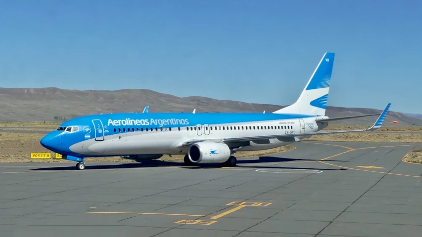 a passenger jet sitting on an airport tarmac