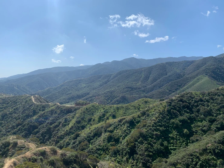 green mountains with a view on some highway