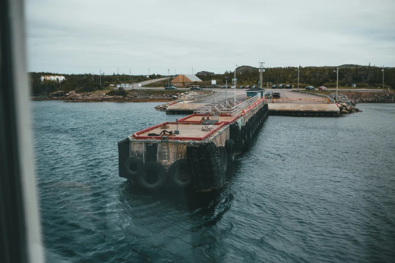 a dock with a large long barge coming out of the water