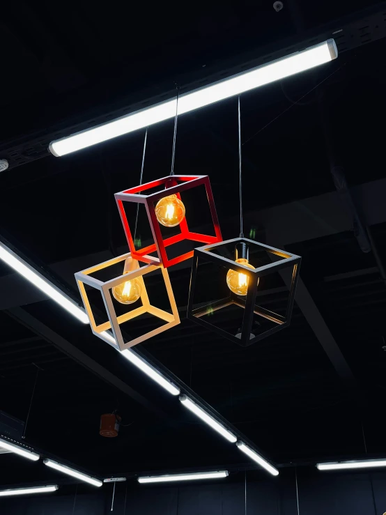 three square lamps hanging from the ceiling