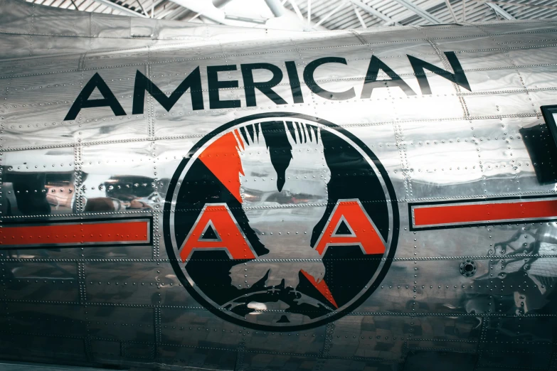an old airplane with an american logo on it