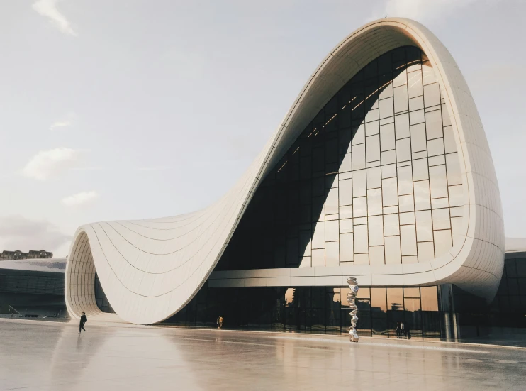 an unusual shaped building on a beach