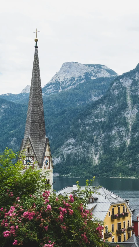 a view of a town with a steeple in front