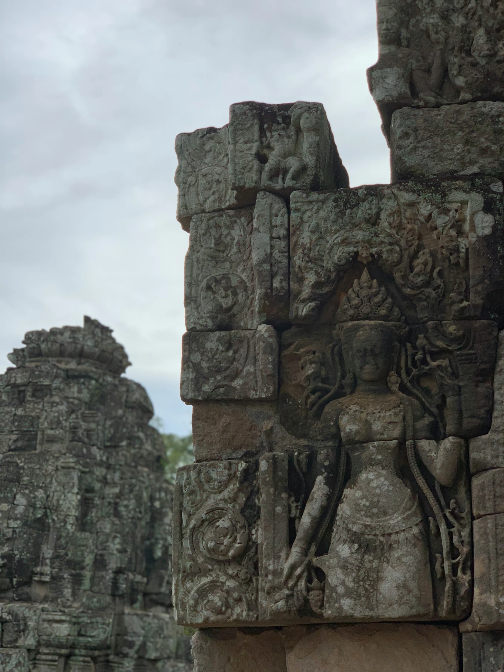 an intricate carvings is on a wall in a stone temple