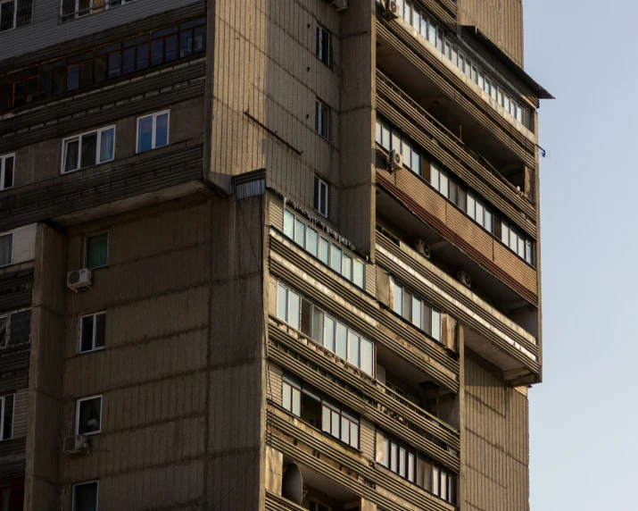 an image of a tall building with balconies on it