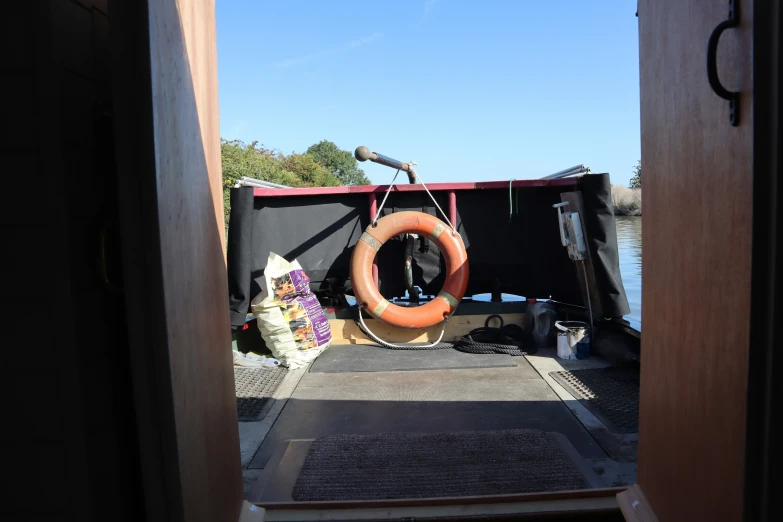 a boat docked in a bay with life preserver