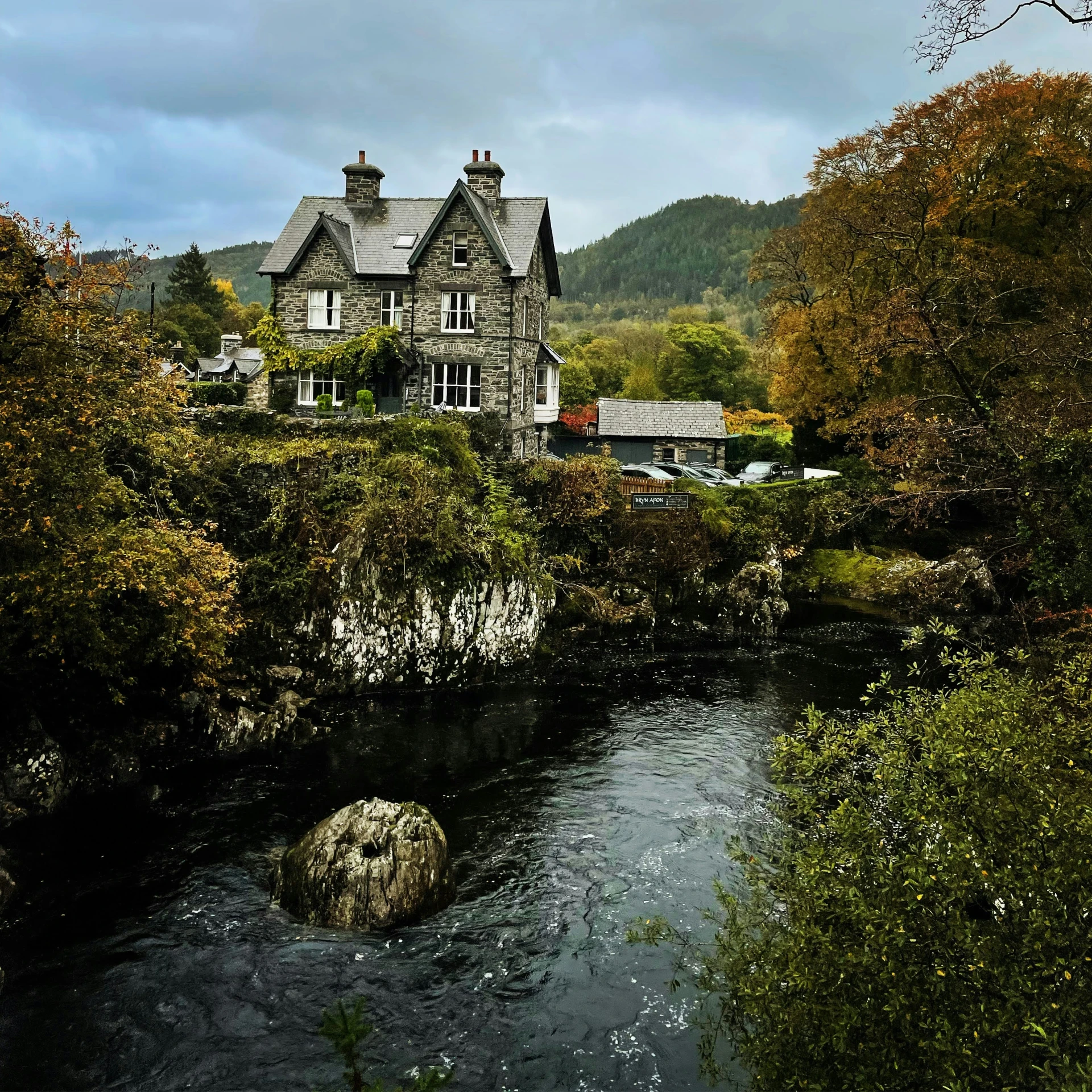 an image of a house in the middle of a river