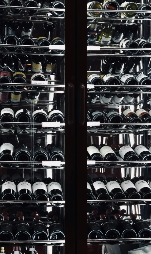 wine rack filled with a lot of bottles in a room