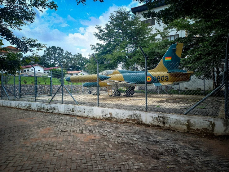 an iron fence with two planes on it