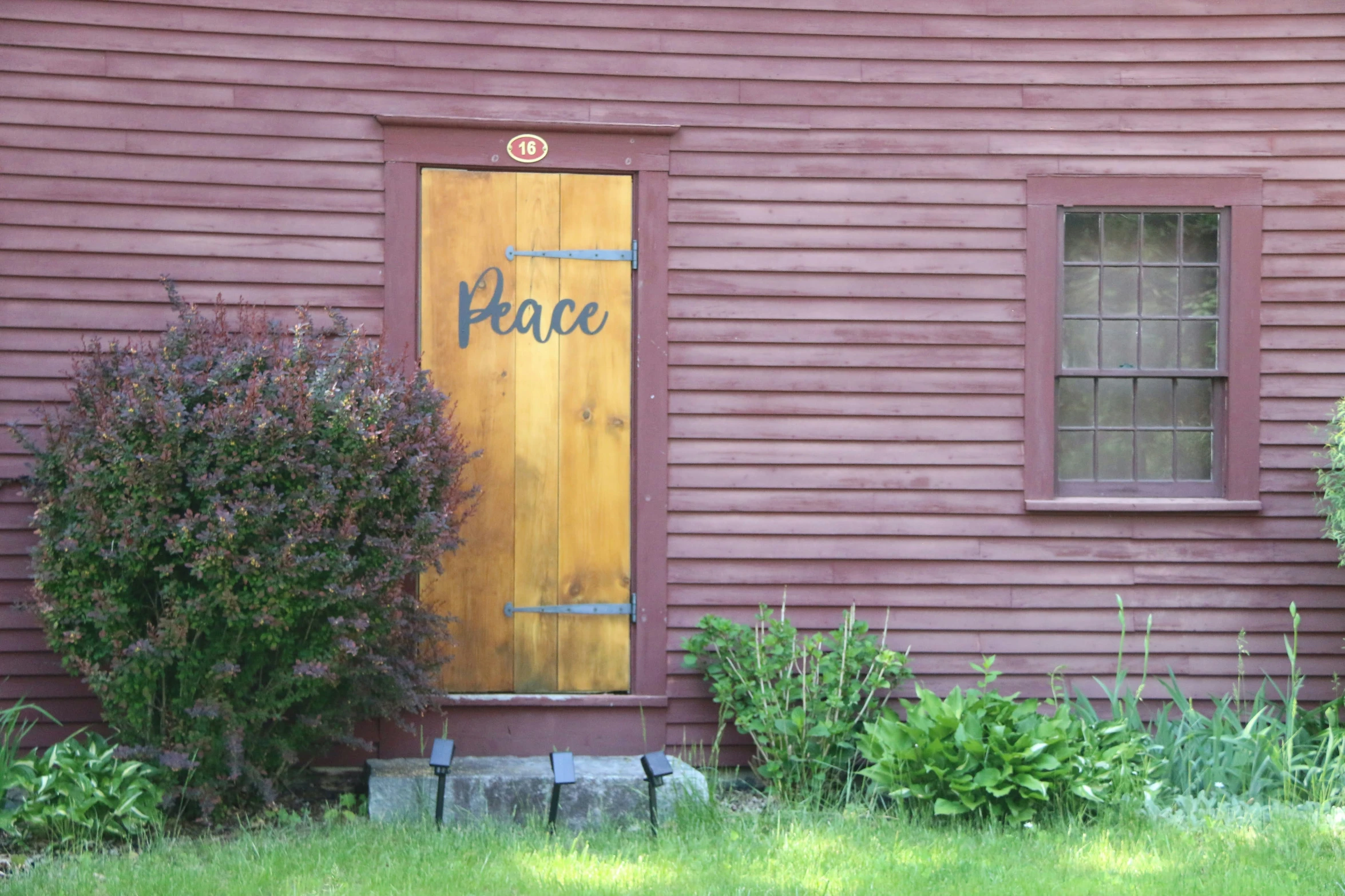 a wooden door with the word hope written on it