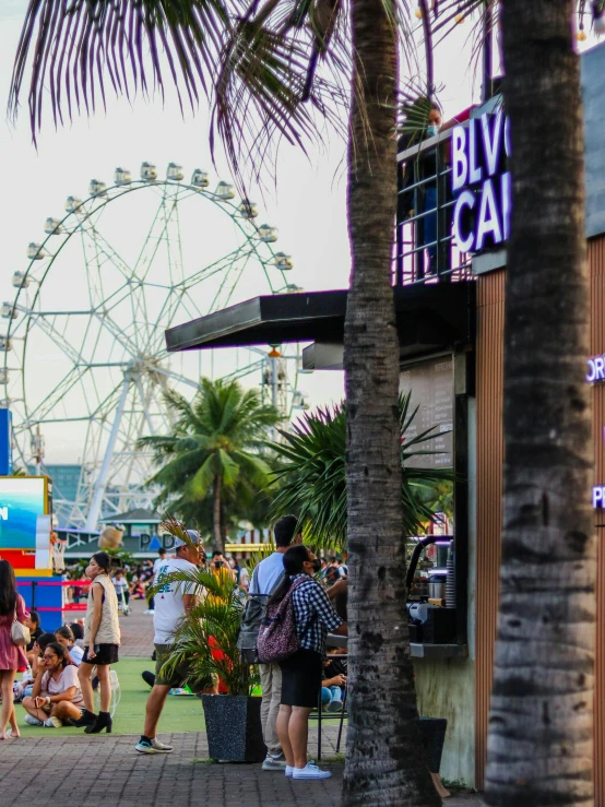 the people at the fair are looking out to sea