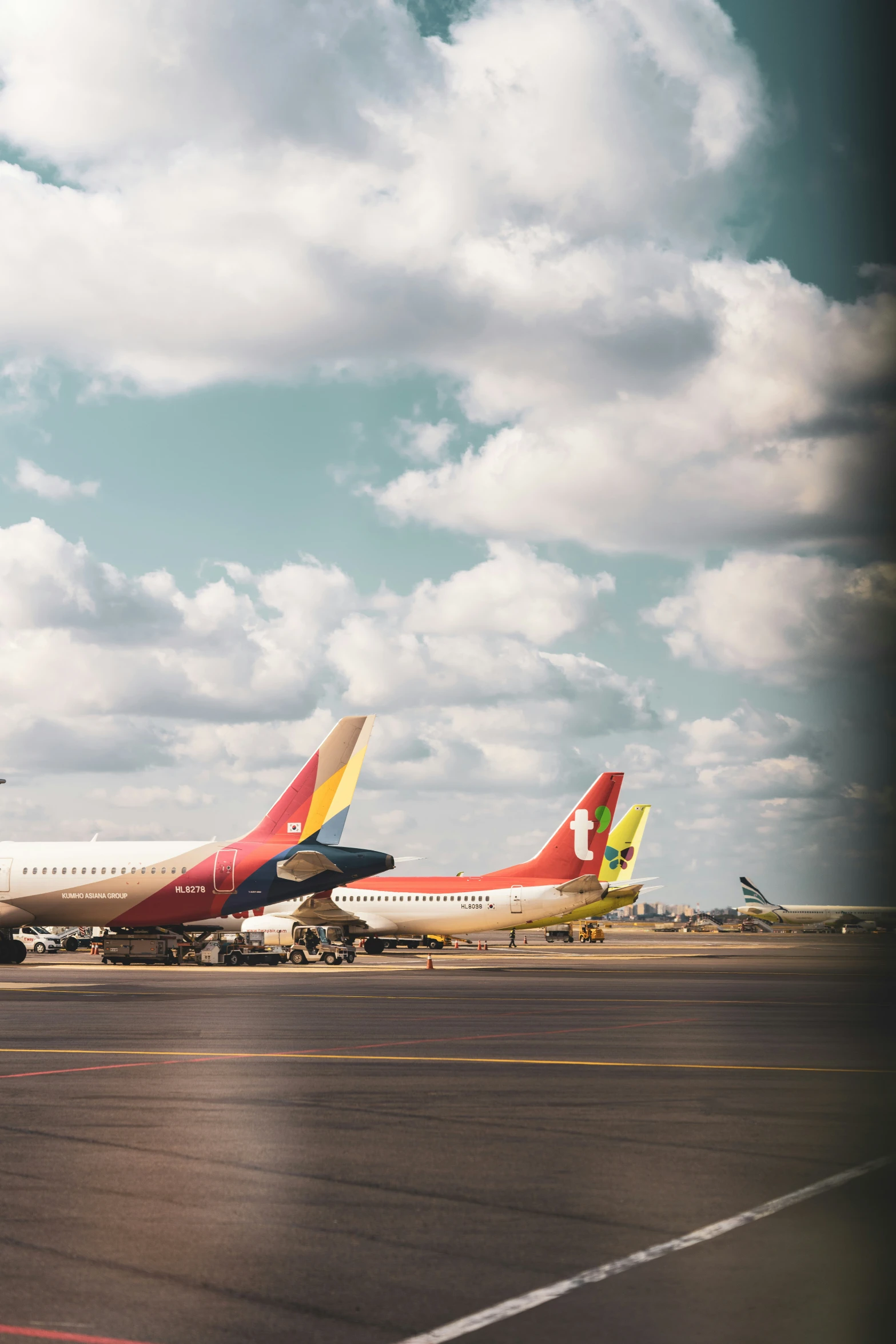 a pair of airplanes are shown sitting on a runway