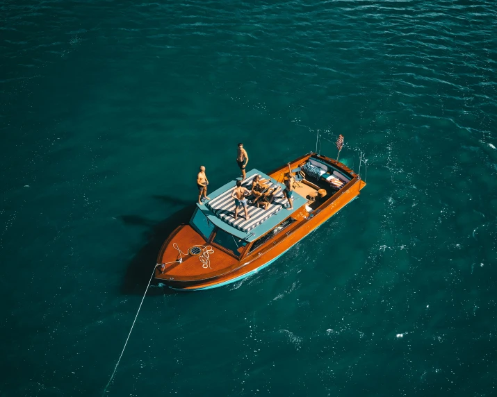 a man is riding on the back of a motor boat