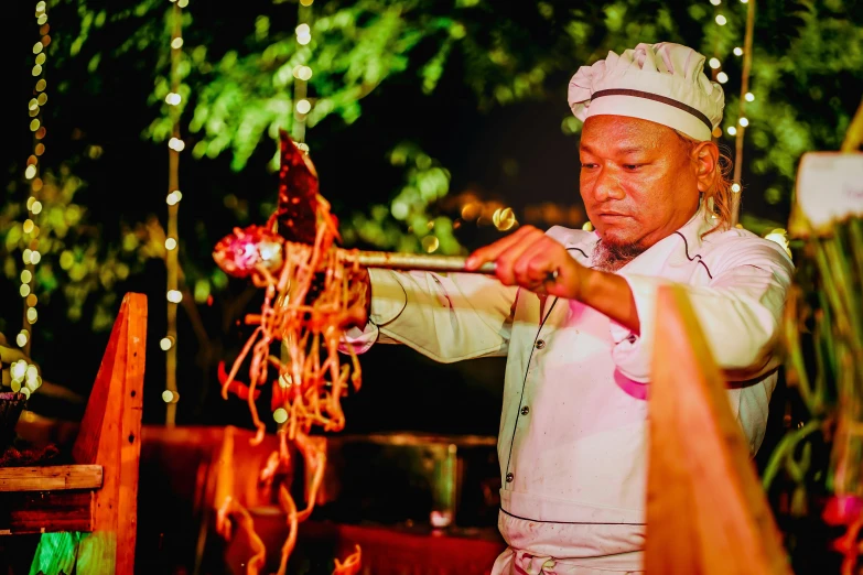 a man in white clothes is holding a bow