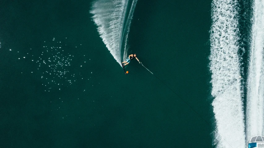 a man riding a wave on top of a surfboard