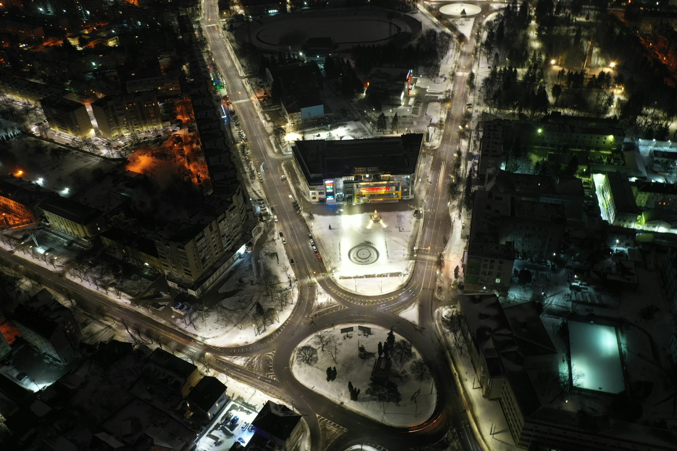 an aerial view of a parking lot in a city