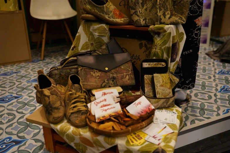 a pile of shoes sitting on top of a table