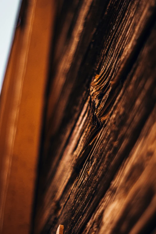 close up view of wooden structure with string, nail and glass