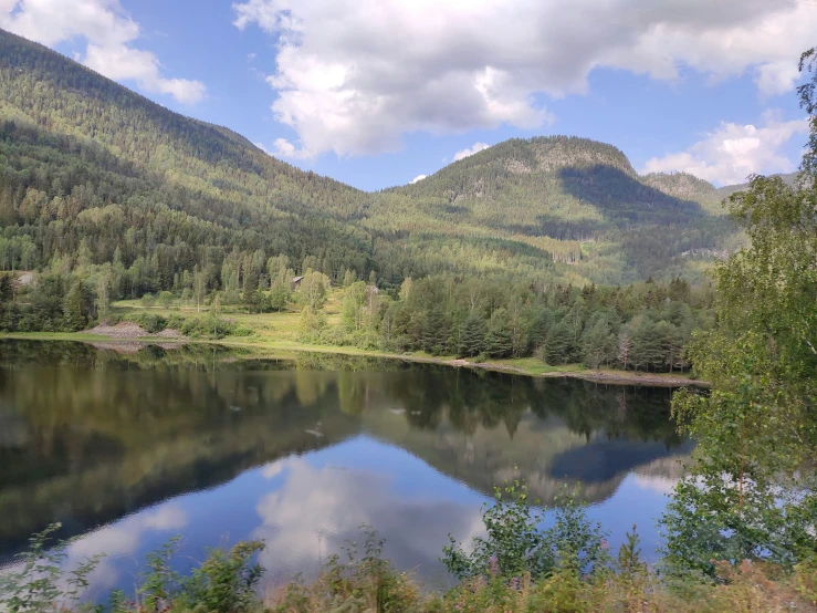 there is a small lake in the middle of a valley