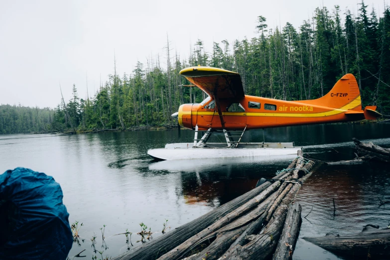 a plane is sitting on an object in the water