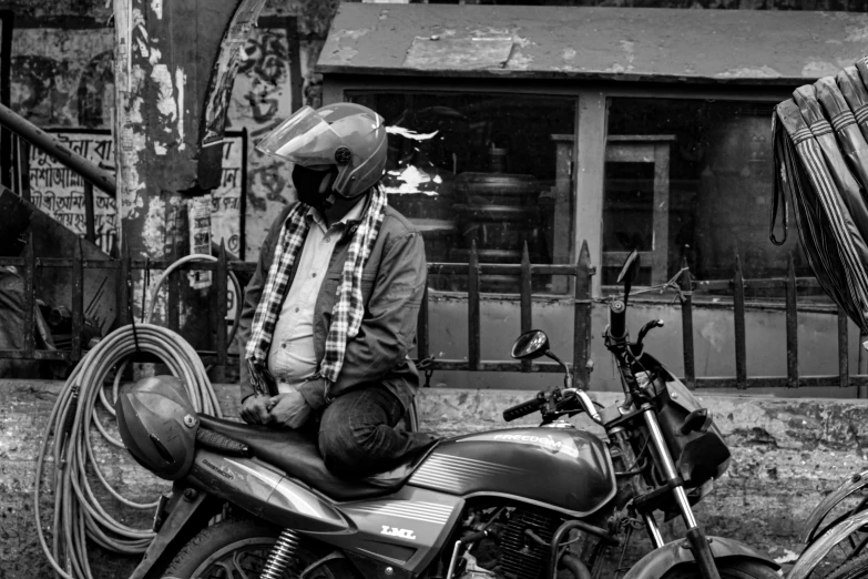 this is an old picture of a man on his motorcycle