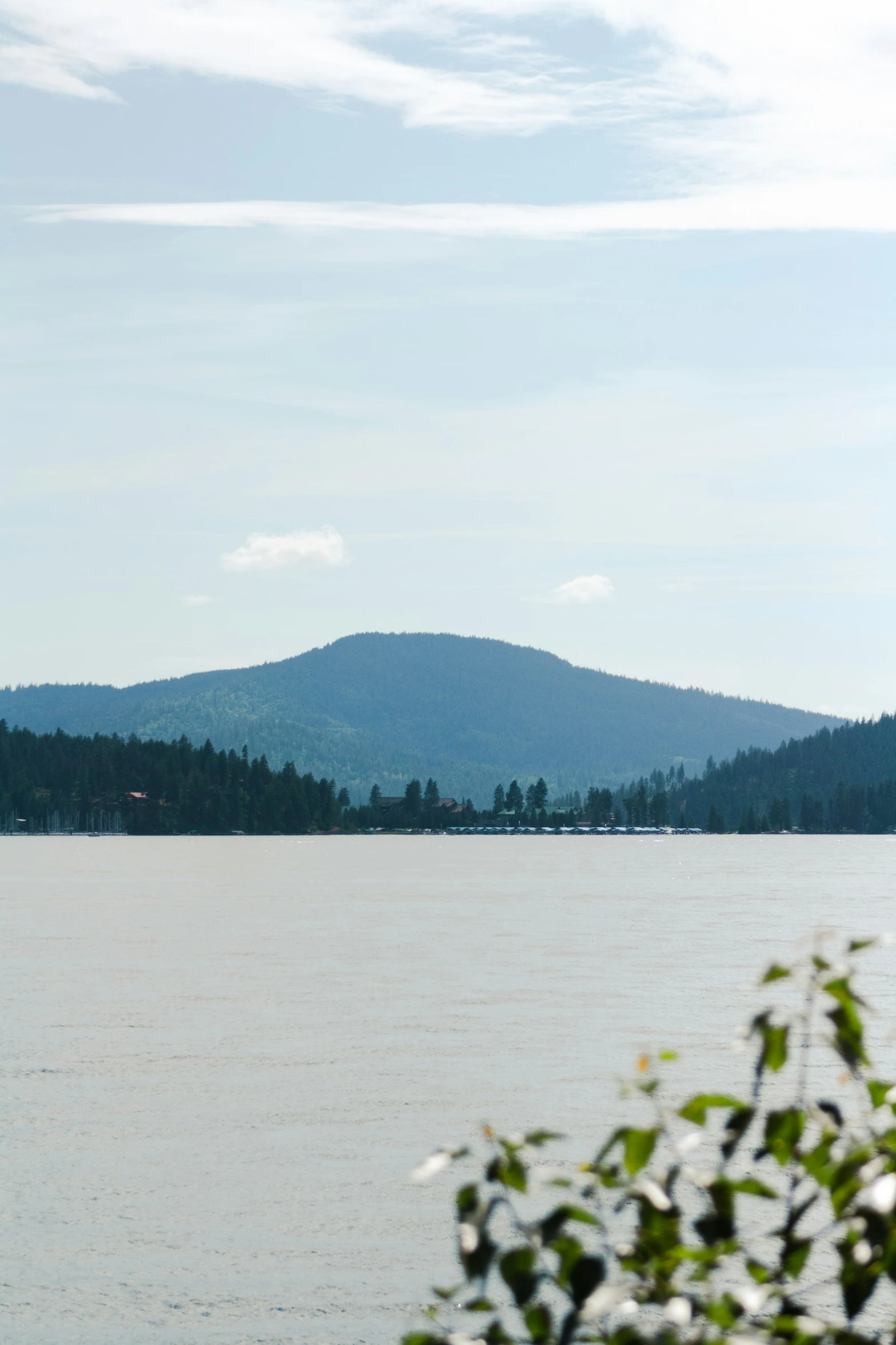 a boat on a lake near a mountain