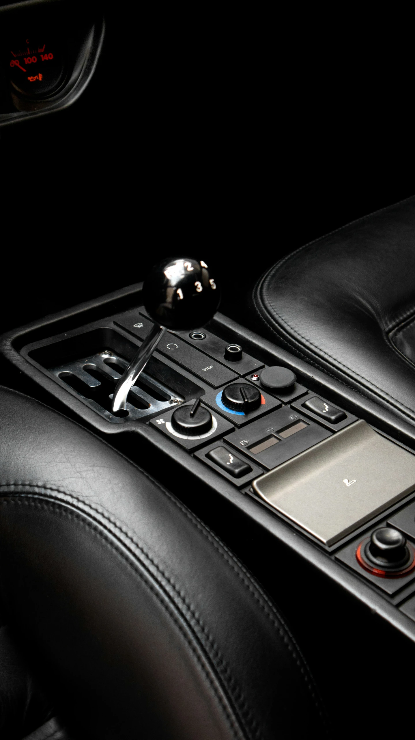 black leather interior with controls and ons on a modern vehicle