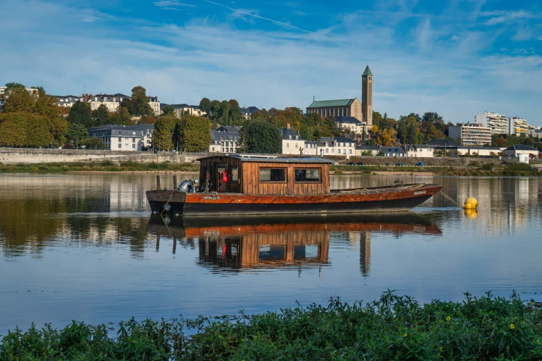 a boat is docked in the water near the city