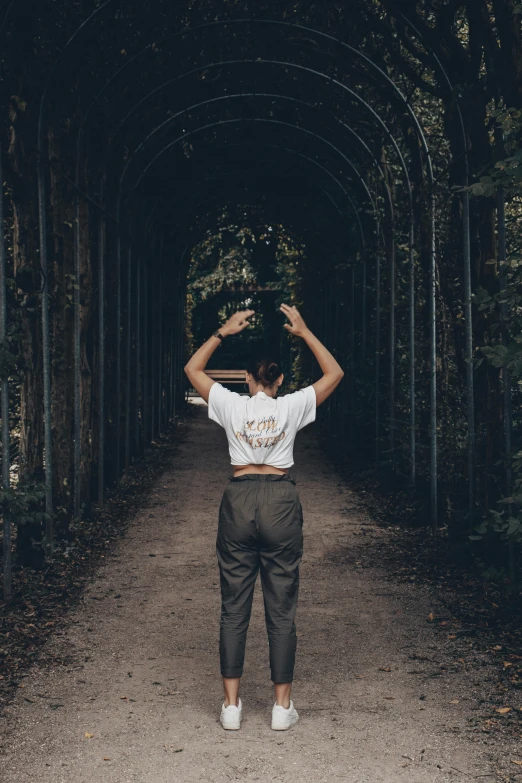 a person is walking in the middle of a tunnel