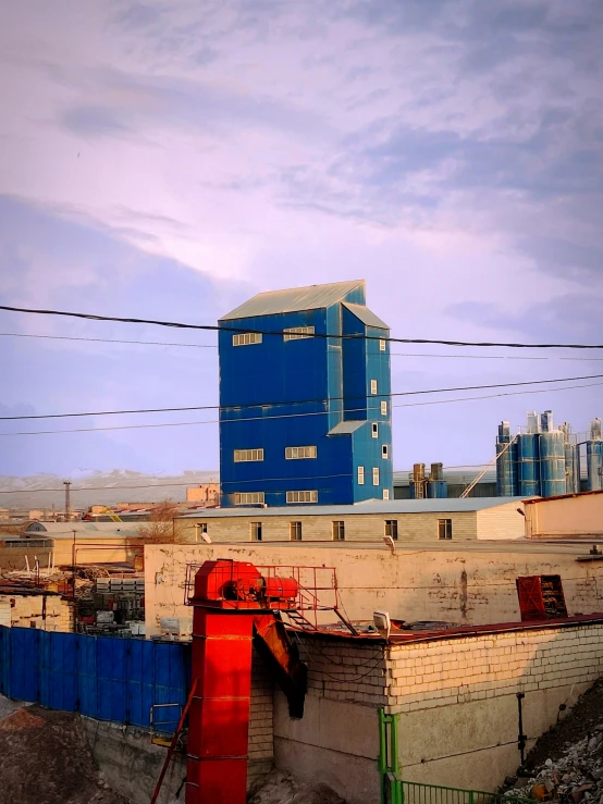 an old city with blue buildings in the background